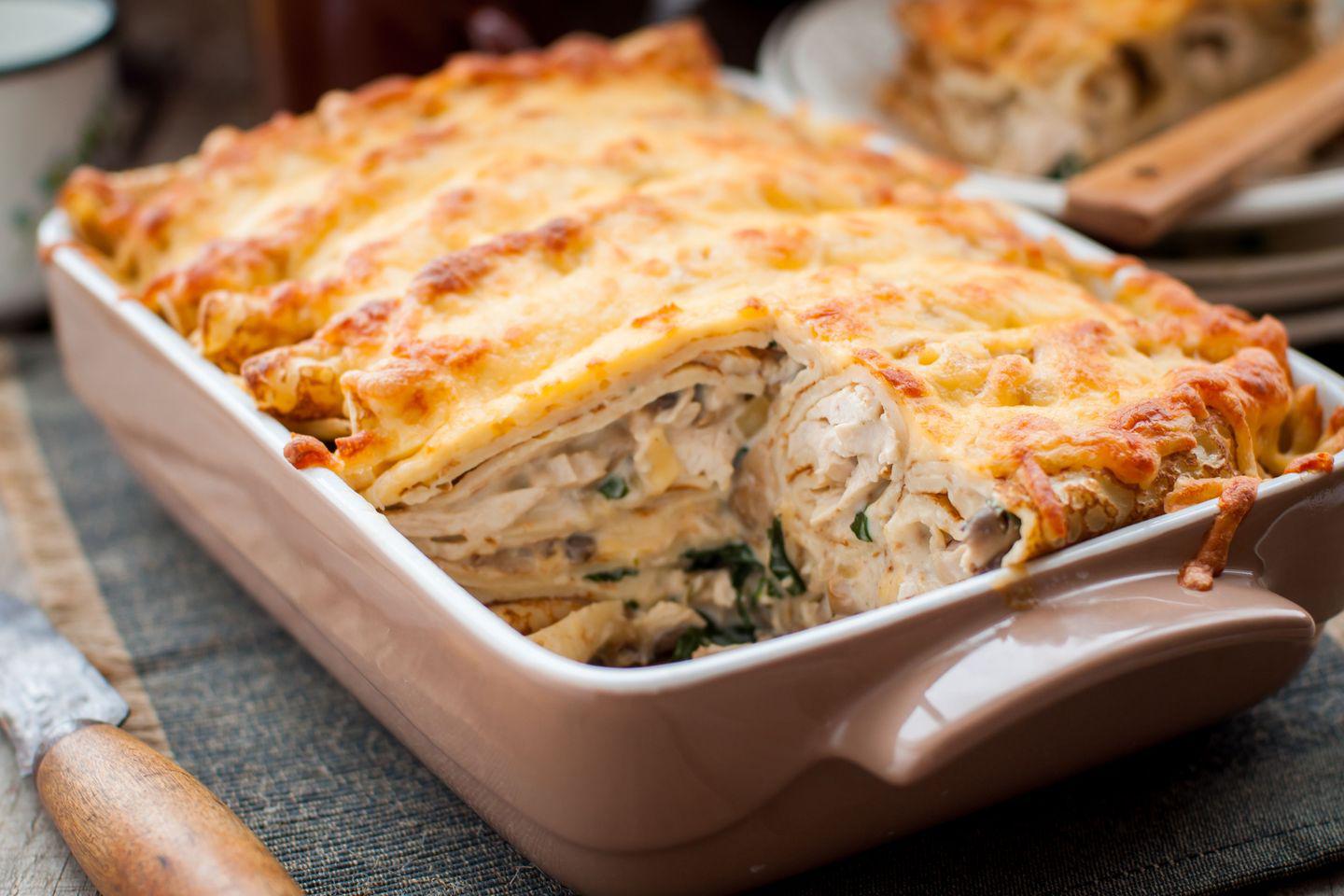 Juicy pancake casserole with chicken, mushrooms and spinach