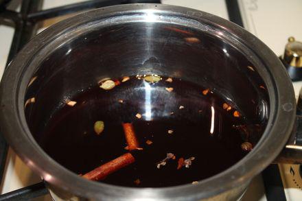 Fragrant homemade red mulled wine with apple, orange and spices