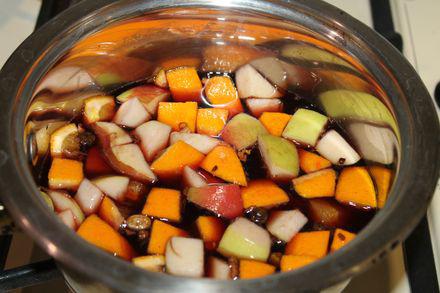 Fragrant homemade red mulled wine with apple, orange and spices